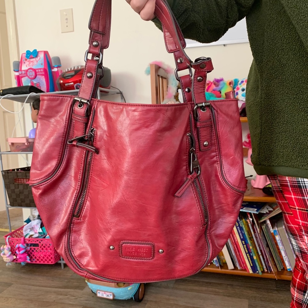 Woman's light red bag